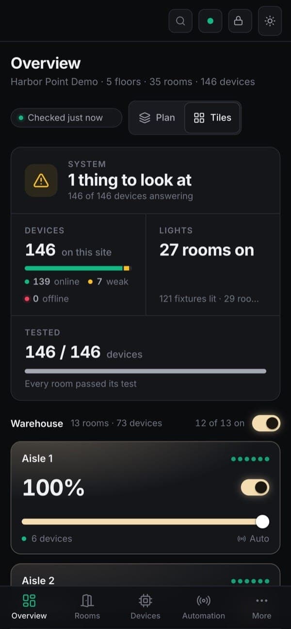 The LuxNet console on a phone: a demo site with 146 devices answering and every room passed its test